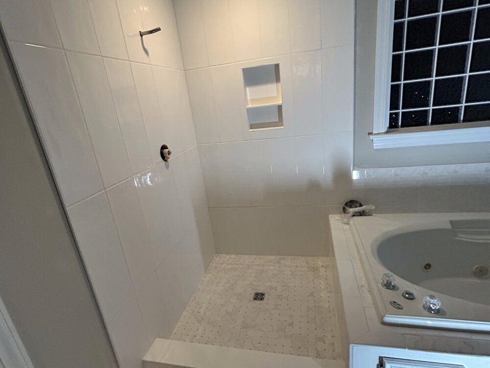 Completed FIG bathroom remodel — jetted tub and tiled shower