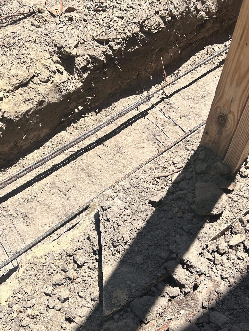 Completed FIG foundation — footing trench with rebar