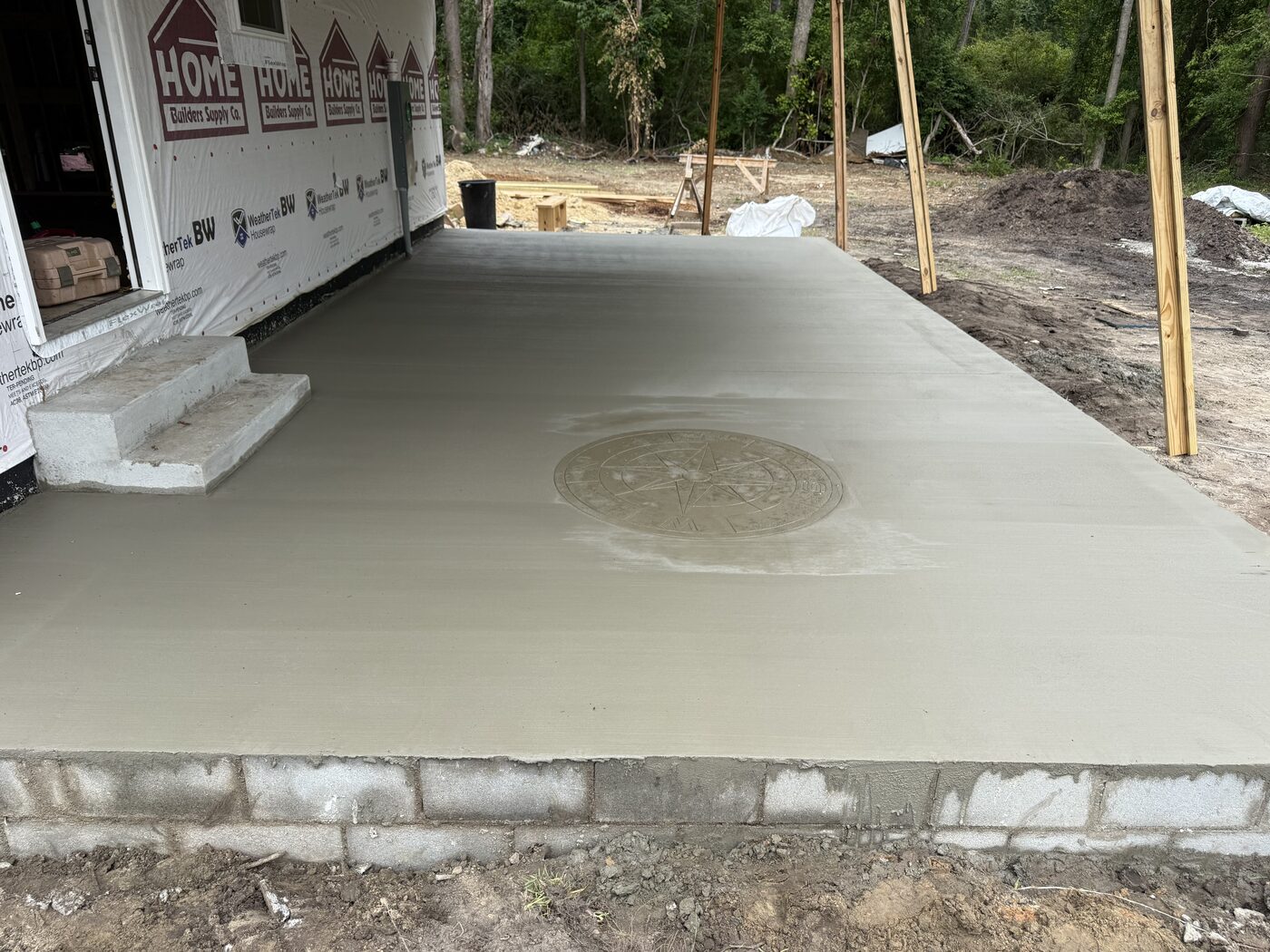 Completed FIG stamped concrete slab with compass-rose medallion