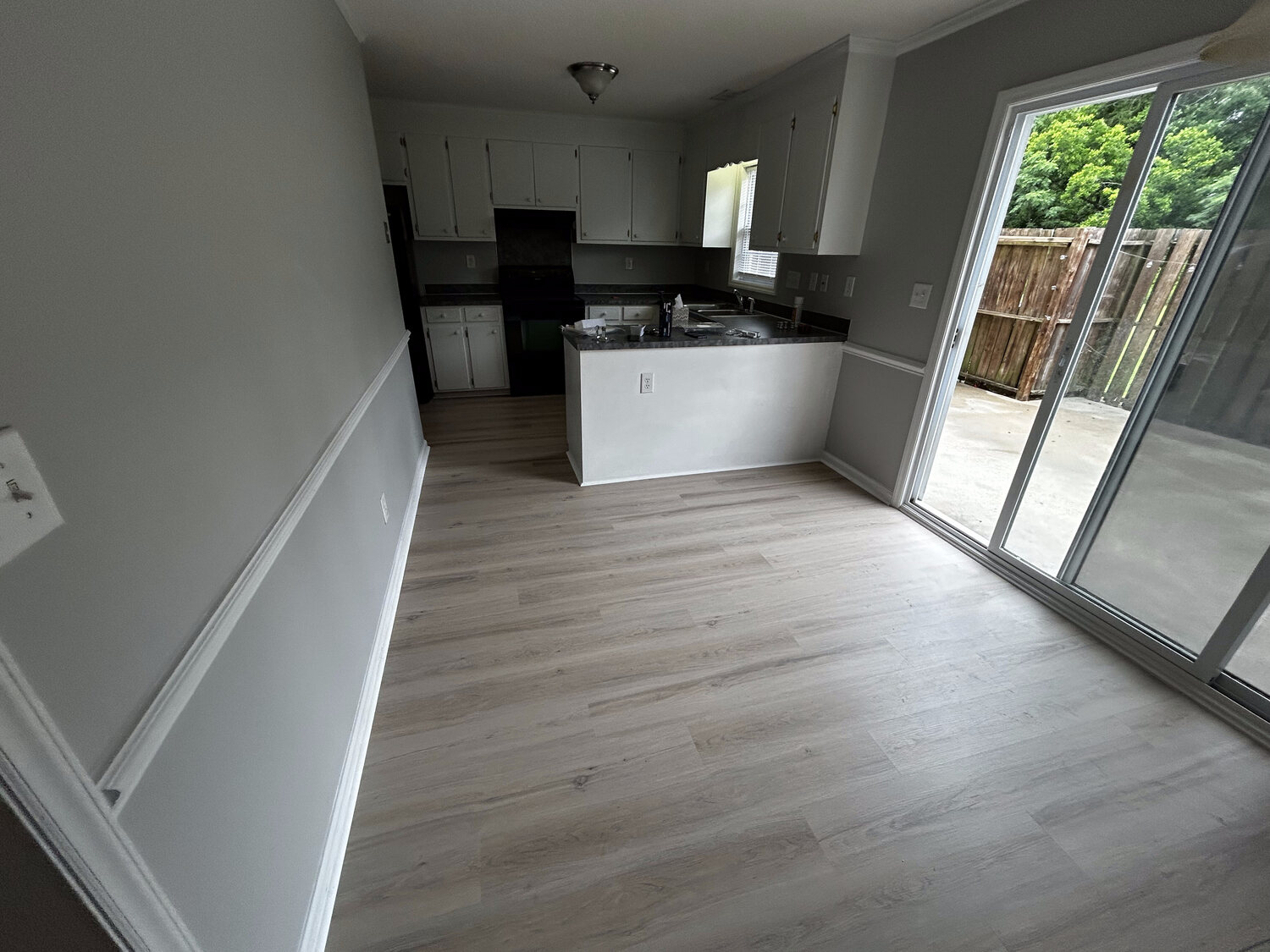 Completed FIG LVP wood-look flooring — kitchen and dining