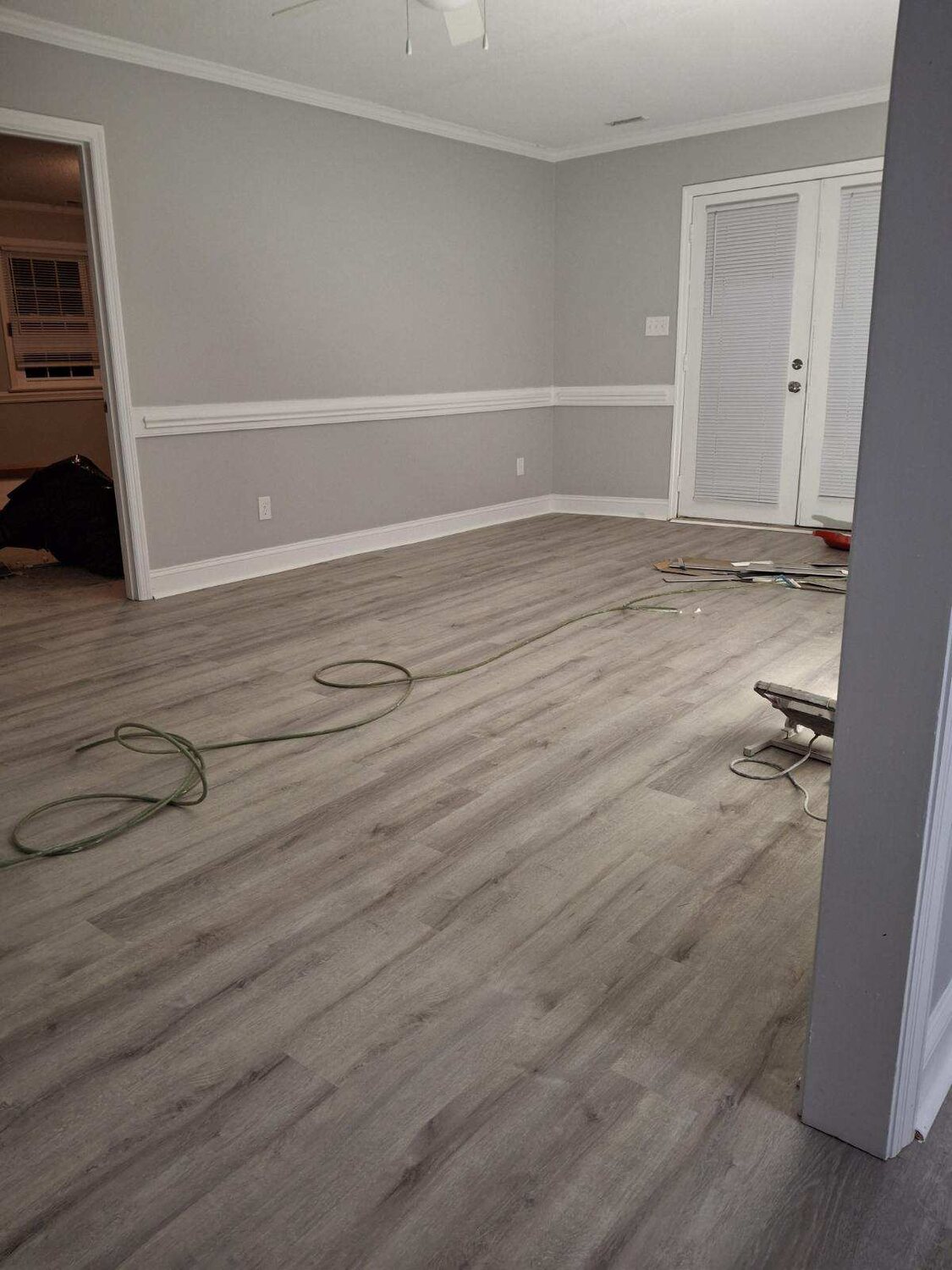 Completed FIG LVP wood-look flooring — living room
