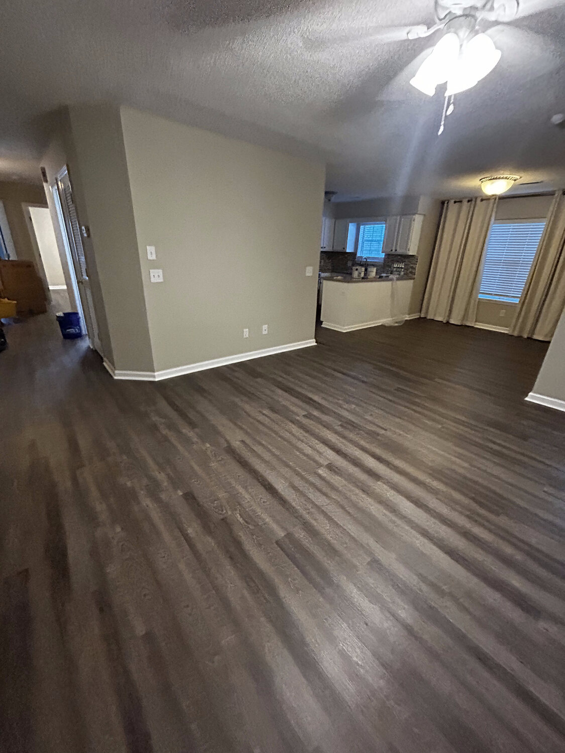 Completed FIG LVP wood-look flooring — open living area