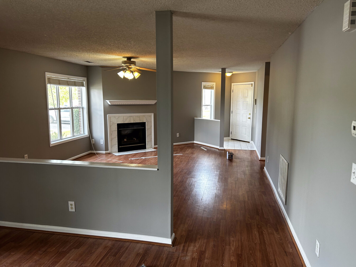 FIG interior painting — open living area, two-tone walls (finished)