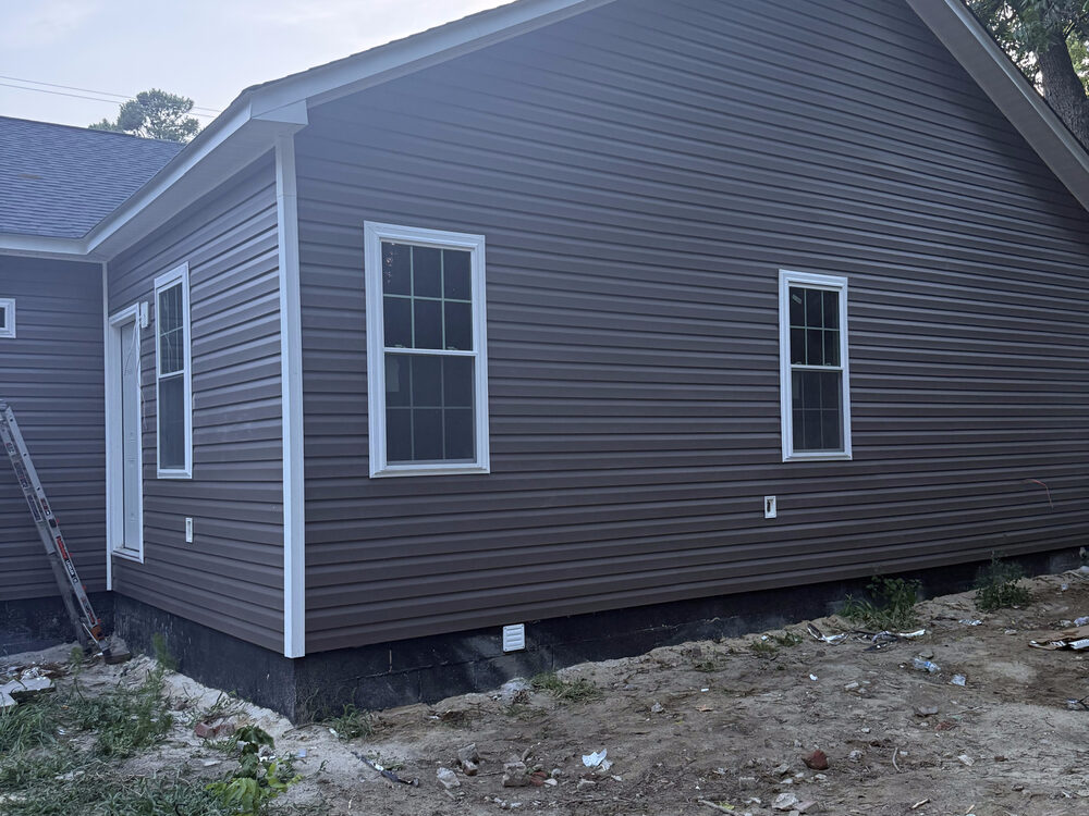 Completed FIG vinyl siding — finished home