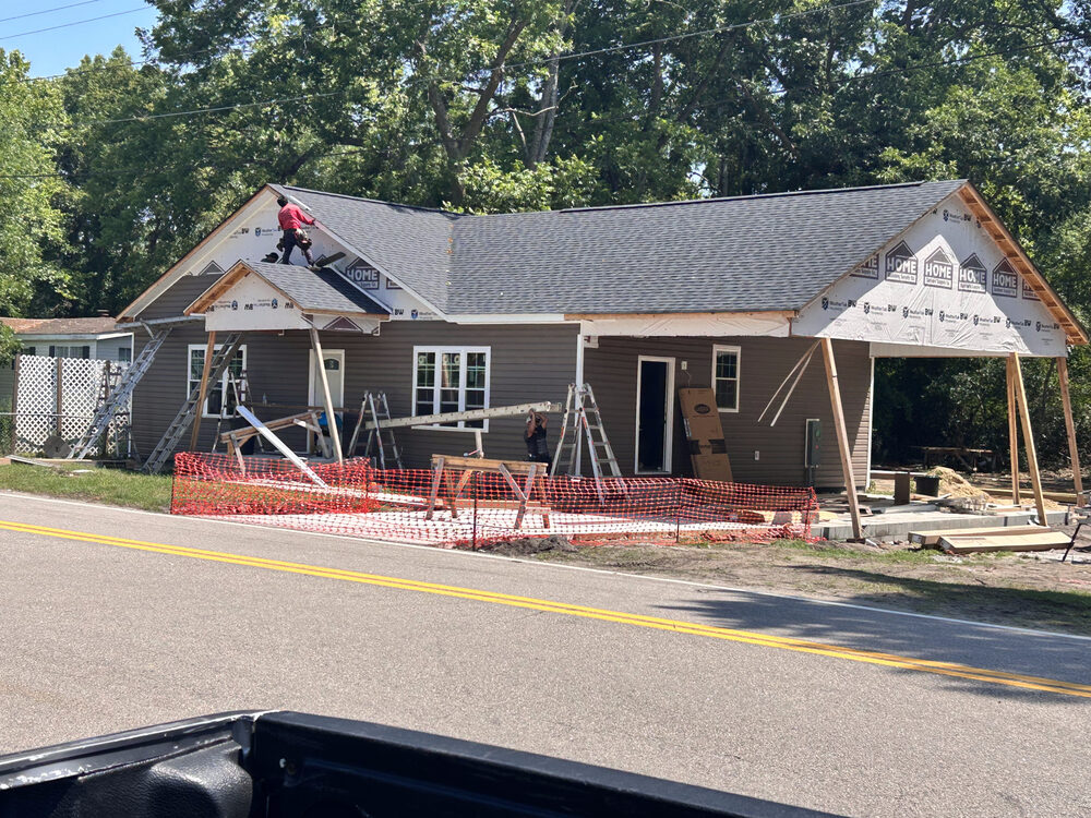Completed FIG exterior — roofline and siding