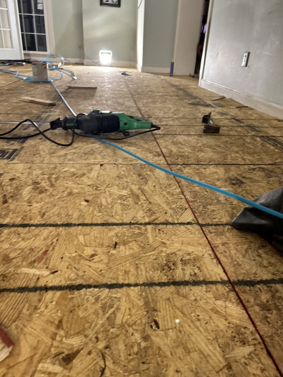 FIG interior — installing OSB subfloor over joists