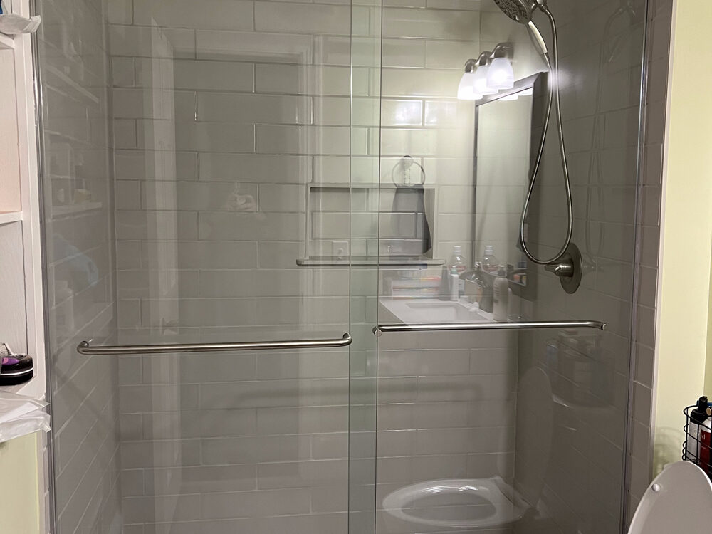 Completed FIG bathroom remodel — glass tiled shower